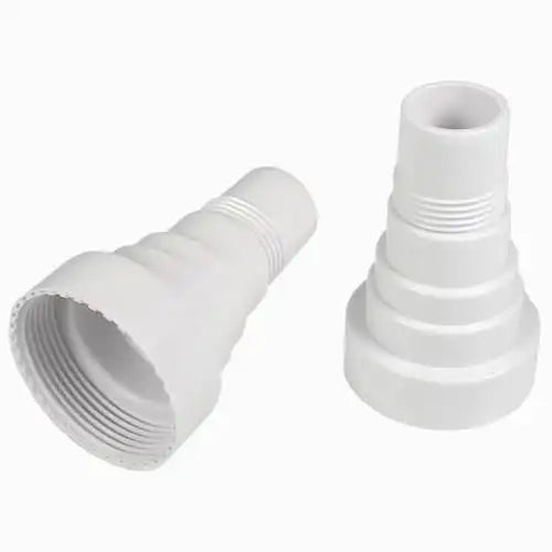 Two white plastic plumbing connectors on a white background