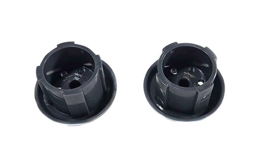 Two black plastic components on a white background