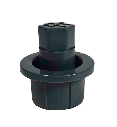 Green plastic component on a white background