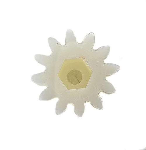 White gear-like object with a yellow center on a white background