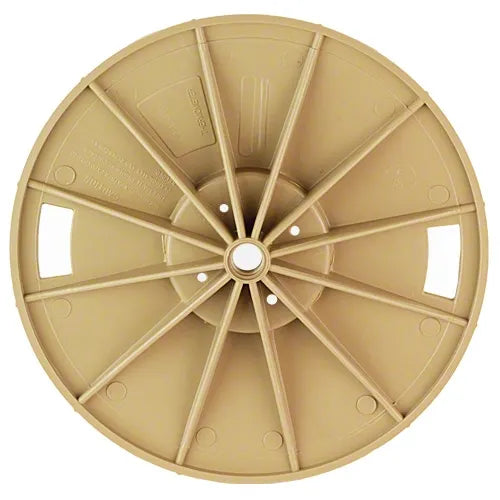 Beige plastic wheel or rim on a white background