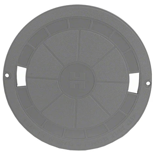 Round gray plastic cover with cutouts on a white background